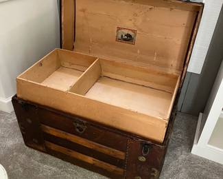 View of the inside of the antique steamer trunk.