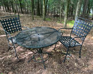 Three-piece set of metal patio furniture.
