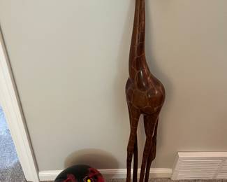 Wood giraffe sculpture/carving, approximately 2’ tall; Storm bowling ball.