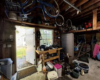 Full garage – yard tools, garden equipment, bikes, planters and more