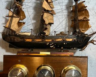 Vintage "Fragata Espanola" model ship on weather station shelf