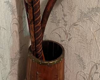 Vintage barrel with assorted carved wood canes