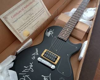 Popular indie Rock Group , Green Day , signed guitar. With certificate of authentication 