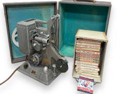 Vintage Keystone 8 MM Movie Projector Model R-8 w/ A Collection Of Castle Films War Related 8MM Film Movies
