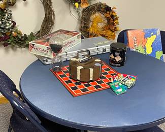 Card table and chairs and vintage games. 