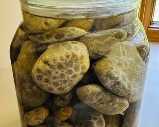 Large glass of Petoskey stones