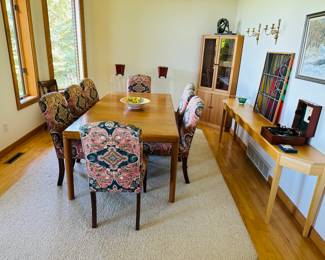 Teak dining table with 8 upholstered chairs and teak corner hutch