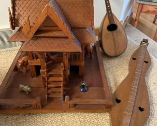 Many vintage stringed instruments including this Silvestri Mandolin