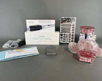 Lot 151 | Bluetooth Earphones and Contents on Tabletop
