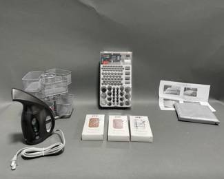 Lot 134 | Mini Steamer, Grooming Kits and Windshield Cover
