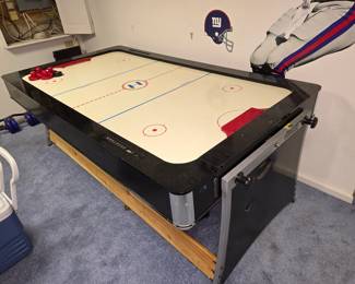 Air hockey table that flips over to a pool table.