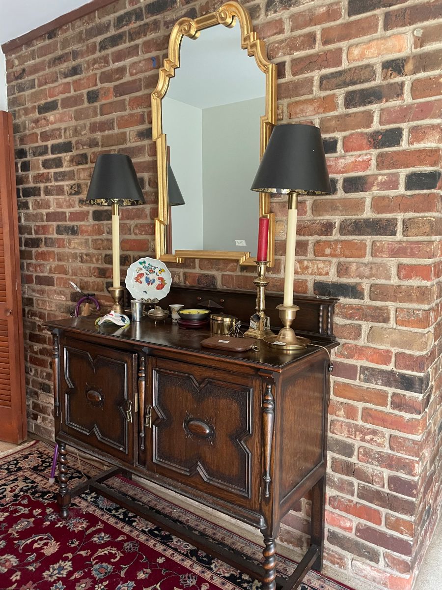 Perfect antique foyer piece. English oak server. Barely twist front legs.  Beautiful Carolina quality traditional mirror. Lamps work perfect 