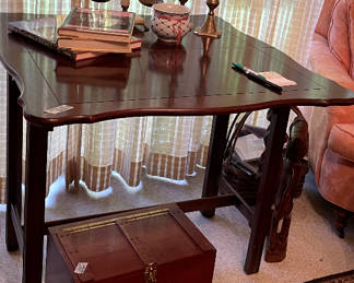 Game table. It folds in half a swivels to make a small table.   Cute little wood hinged box under it. 