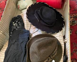 Old boys cowboy cloths. Old gowns . Toys. Dolls etc.  Luggage was full of memories 