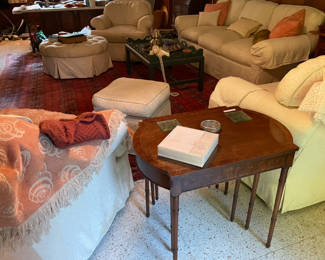 Nest of tables (3) between a pair of white swivel chairs   Comfort here 