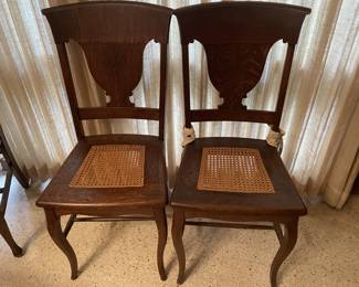 There are six antique cane bottoms. One is an arm chair 