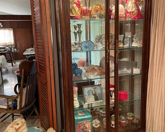 Lighted display cabinet with carved bevel in glass 