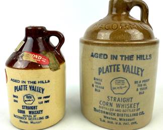 #217 • McCormick Platte Valley Corn Whiskey Jugs - 2 Sizes
