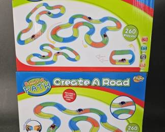 Lot 106 | 2 New Flipo Create a Road Toys