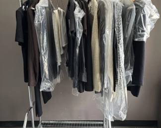 Lot 237 | Clothing Rack with Designer Clothing