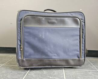 Lot 432 | Vintage Eddie Bauer Rolling Suitcase