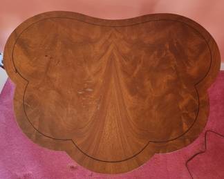 Vintage Scalloped Side Table Handmade by Charak Furniture
A rare find. Designed by Tommi Parzinger for Charak Furniture, Bolton, MA. It is HAND MADE, numbered (4810) and dated 3-30-54. Lovely grain on top, brass detailing connecting four legs. An outstanding example of Mid Century Modern furniture.
30"W x 26"Hx 21"D