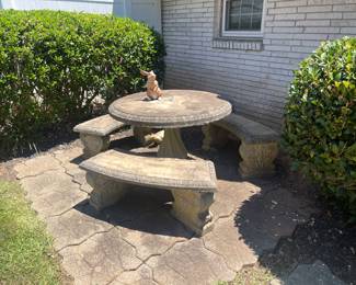 Concrete round table with three benches