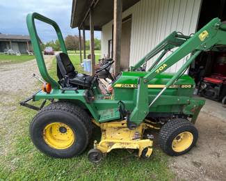 John Deere 855 series w/ multiple attachments