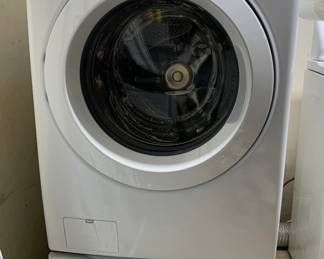 LG Front-Load Washer Washing machine with storage drawer at the base, less than one year old. 