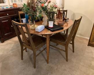 Vintage dining table with four chairs