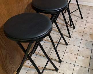 Set of four fold-up barstools