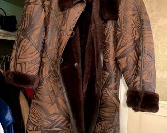 #55	Leather/Faux Fur Coat - Size 12	 $75.00 
