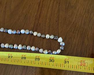 #215		31" Moroccan Pearl Necklace black and white 	 $125.00 			
