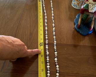 #215	31" Moroccan Pearl Necklace black and white 	 $125.00 			
