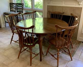 #4	laminate top round table with QA legs with 2 leaves and 6 spindle chairs 54-x54x39 as is top. 	 $180.00 
