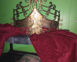 Crown secured to wall above any bed and drapes material 