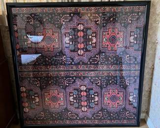 This is framed textile, behind glass.  You could spend hours gazing into the intricate designs.