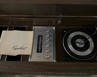 Here we have a Capehart console AM/FM radio receiver with turntable.  