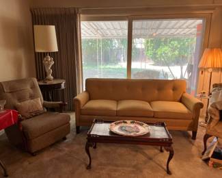 This is a nice overview picture of the living room.  See the sofa, recliner, coffee table, side table, a floor lamp, a table lamp, and much more!