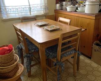 Here is a very nice table and matching chairs.  The trivets are also quite nice.