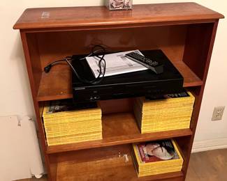 Here we have a short bookcase, holding several issues of National Geographic magazine.  You'll have to come by the sale to see which we have and which we don't.