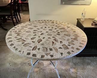 This is an interesting stone inlaid table, made in Mexico, or hecho en México.