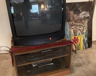 And what sale would not be complete without a television and other audio / video equipment.  You can also see several unframed art pieces nearby.