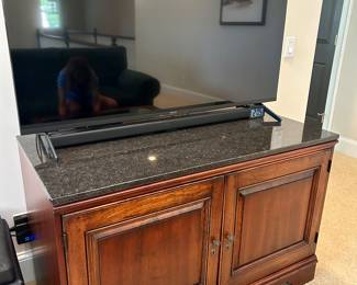 Black marble top entertainment cabinet by Bob Timberlake. 4’ wide.
55” Sony TV