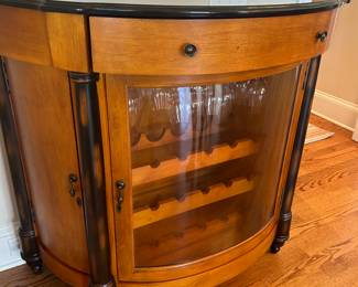 Wine cabinet by Howard Miller. 44” wide, 22” deep