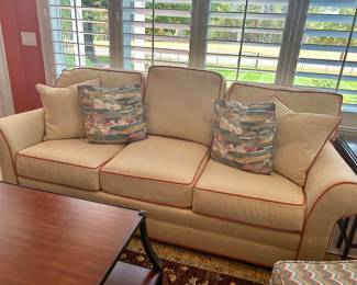 Off-white/tan with rust piping sofa 86” long by Harden