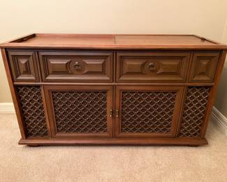 Vintage Magnavox Stereo console on rollers with working radio and turntable
