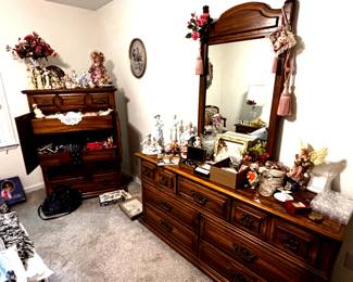 Entire Broyhill bedroom suit including bed frame, mattresses, two night stands, upright dresser, long dresser with morror. Also pictured- figurine collection in victorian and early 20's era.