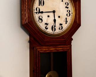 Several antique wind up clocks.