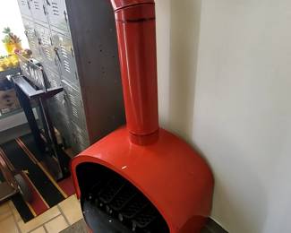 We are selling this beautiful red, mid-modern steel fireplace. This is a rare find and measures 27 7/8" x 55 1/2" x 19 3/4". Owned for two decades, was originally purchased in Cheyenne, Wyoming.